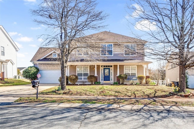 view of front of house with a porch, concrete driveway, and an attached garage