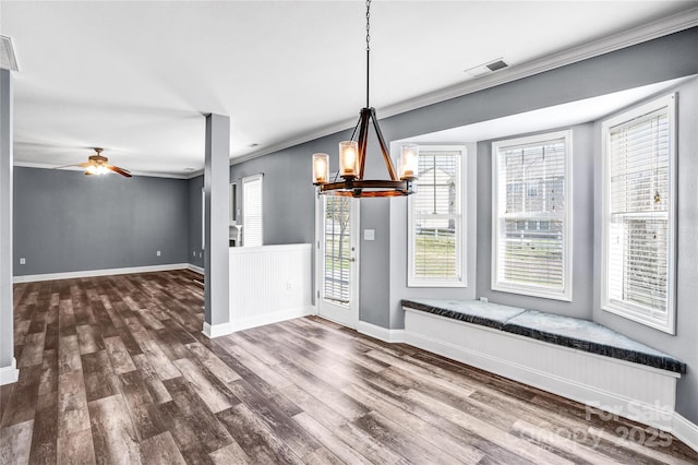 unfurnished dining area featuring visible vents, baseboards, and wood finished floors