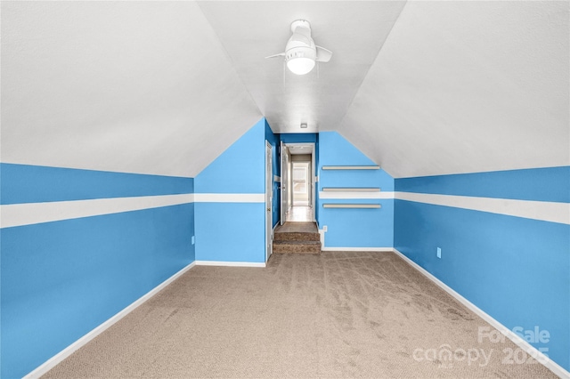 bonus room with baseboards, carpet, a ceiling fan, and vaulted ceiling