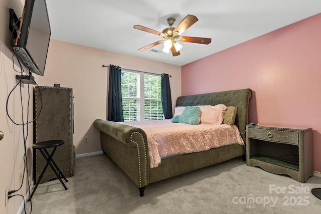 carpeted bedroom with ceiling fan, visible vents, and baseboards