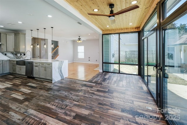 kitchen with wooden ceiling, open floor plan, light countertops, gray cabinetry, and a sink