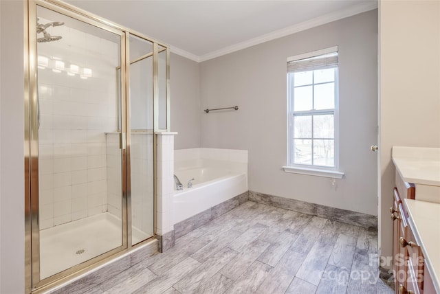 full bath featuring crown molding, a shower stall, vanity, and a bath