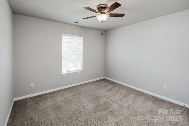 unfurnished room with a ceiling fan, carpet, visible vents, and baseboards