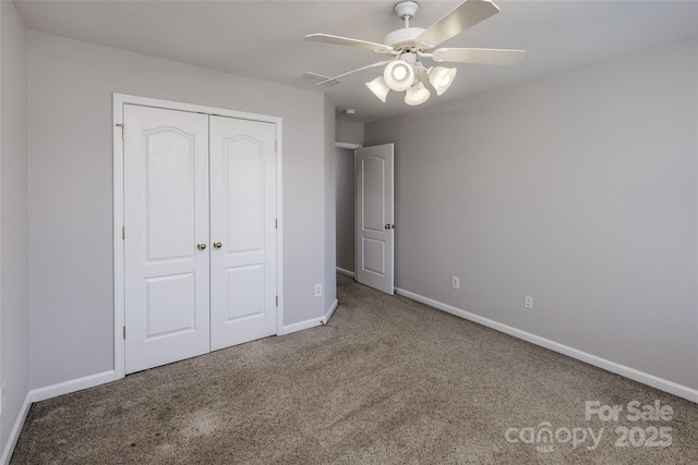 unfurnished bedroom featuring carpet, a closet, visible vents, and baseboards