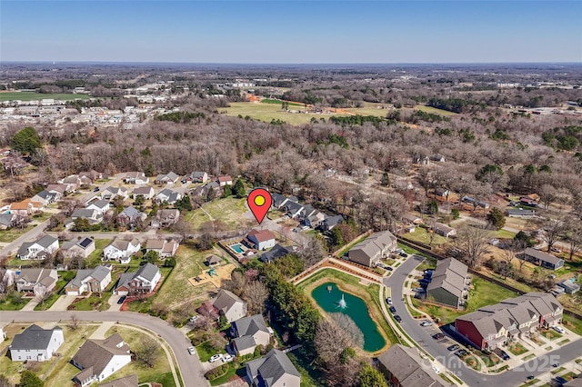 bird's eye view featuring a residential view and a water view