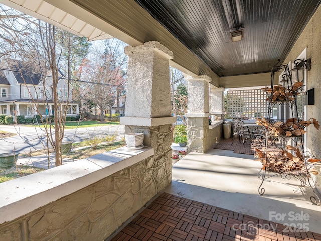 view of patio featuring a porch