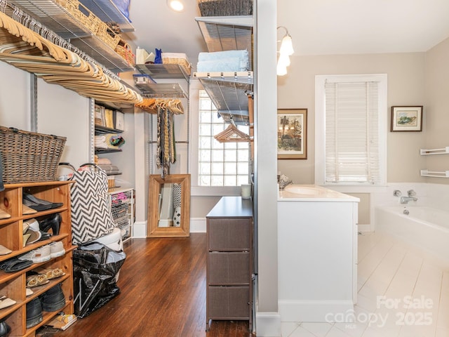 interior space featuring a sink and wood finished floors