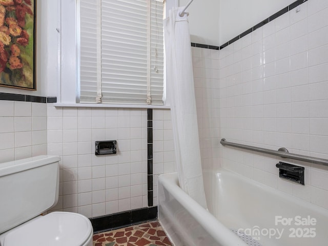 full bath featuring toilet, shower / tub combo, and tile walls