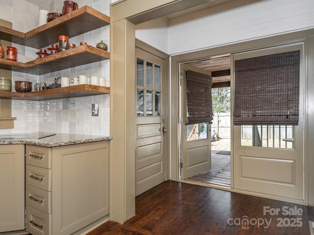 doorway to outside with dark wood finished floors