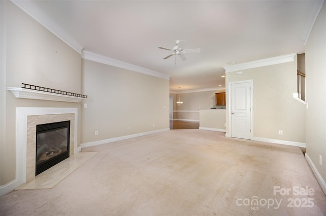 unfurnished living room with a fireplace, ornamental molding, light carpet, ceiling fan, and baseboards