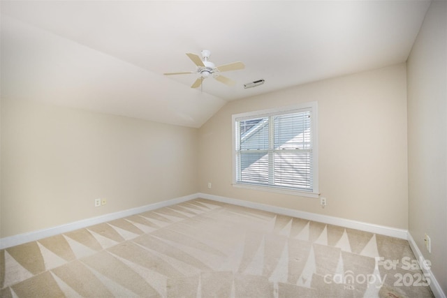 bonus room featuring light carpet, vaulted ceiling, visible vents, and baseboards