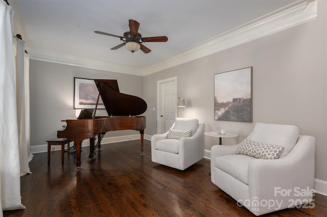 living area with ceiling fan, wood finished floors, baseboards, and ornamental molding