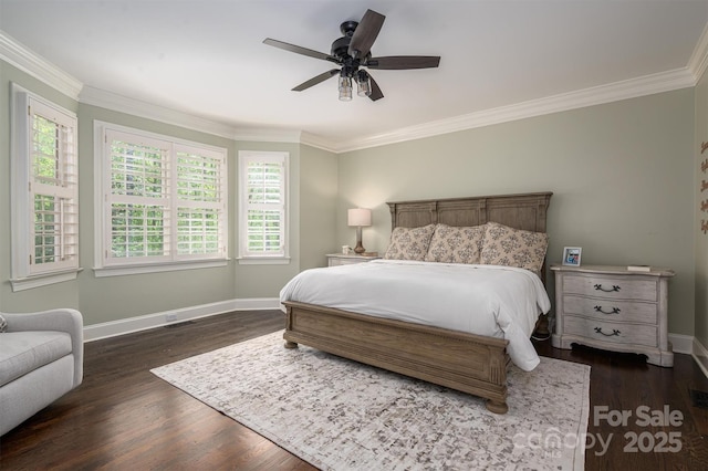 bedroom with dark wood finished floors, crown molding, baseboards, and a ceiling fan