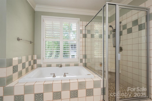full bathroom featuring plenty of natural light, a garden tub, and a stall shower