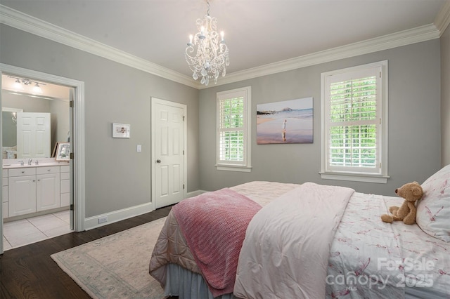bedroom with light wood-style floors, a notable chandelier, ornamental molding, and a sink