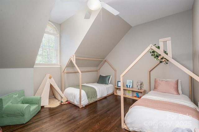 bedroom featuring vaulted ceiling, a ceiling fan, and wood finished floors