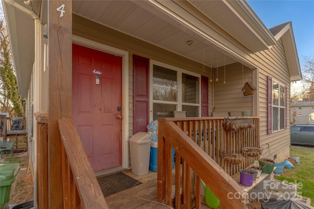 view of exterior entry with covered porch