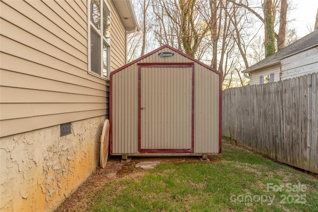 view of shed with fence