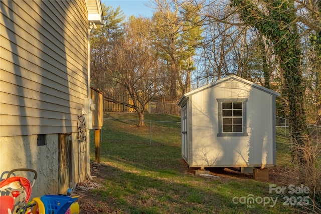 view of shed featuring fence