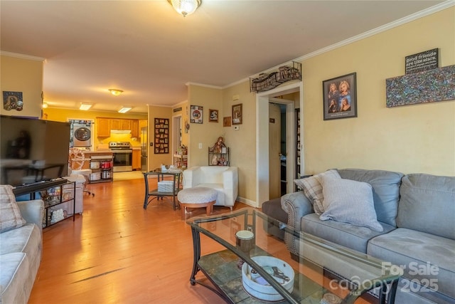 living room featuring light wood finished floors and ornamental molding