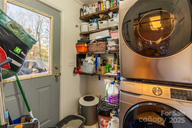 laundry room featuring laundry area and stacked washer / dryer