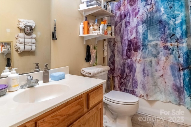 full bath with toilet, tile patterned flooring, shower / tub combo with curtain, and vanity