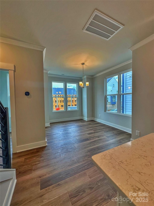 unfurnished dining area featuring plenty of natural light, visible vents, and crown molding