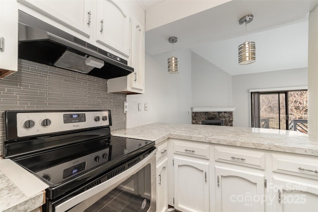 kitchen featuring under cabinet range hood, stainless steel electric range oven, white cabinetry, and light countertops