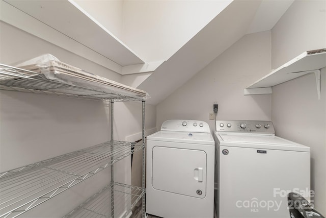 clothes washing area with laundry area and washer and dryer