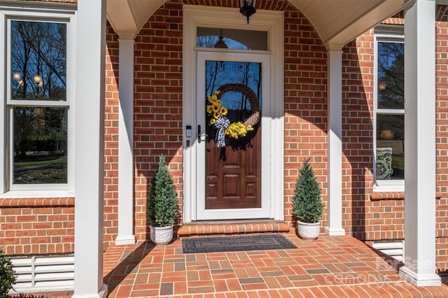 entrance to property with brick siding