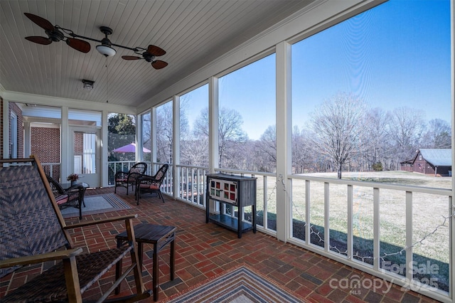 unfurnished sunroom with wood ceiling