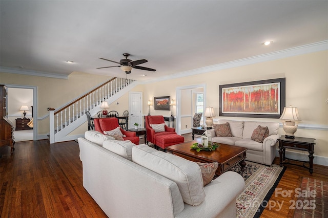 living area featuring baseboards, stairway, wood finished floors, and ornamental molding