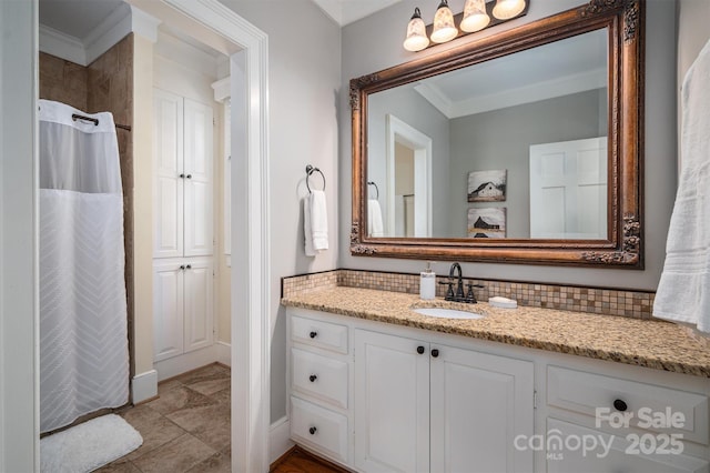 bathroom with ornamental molding, decorative backsplash, vanity, and a shower with shower curtain