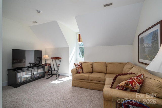 living room with visible vents, vaulted ceiling, and carpet flooring