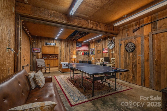 playroom featuring wood walls