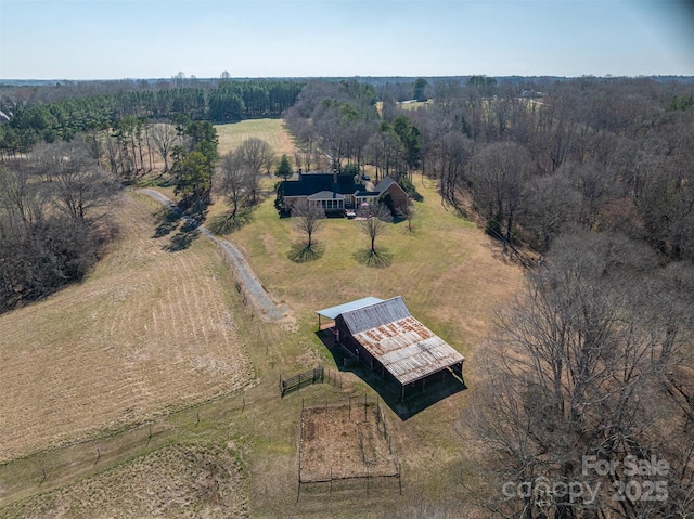 aerial view with a rural view and a view of trees