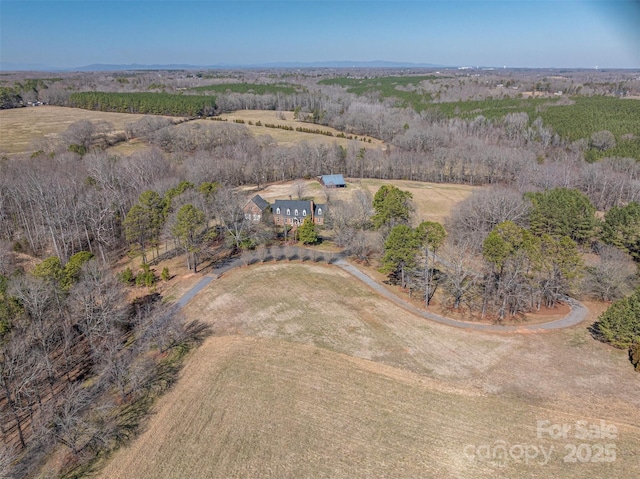 birds eye view of property featuring a rural view