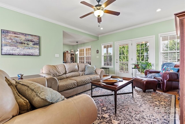 living room with crown molding, wood finished floors, a ceiling fan, and recessed lighting