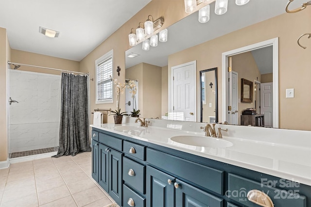 full bath with tile patterned flooring, visible vents, curtained shower, and a sink