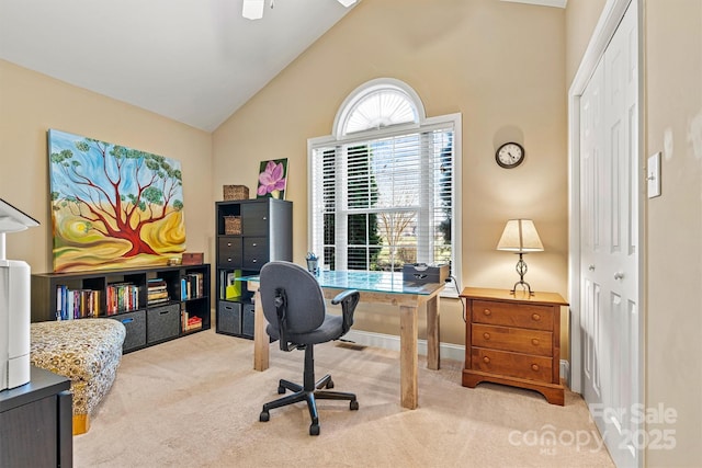 office space featuring a ceiling fan, carpet, and high vaulted ceiling