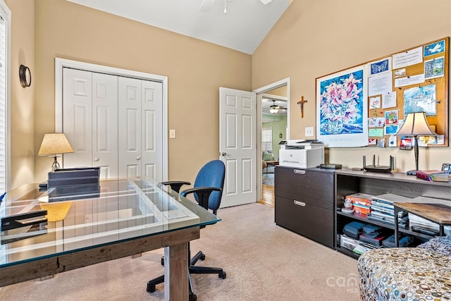 office featuring light carpet, lofted ceiling, and a ceiling fan