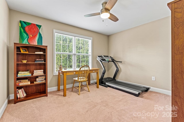 exercise room with baseboards, carpet floors, and ceiling fan