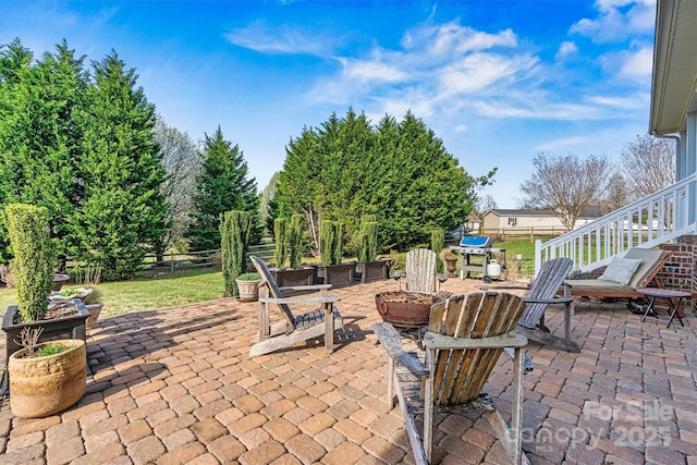 view of patio featuring fence