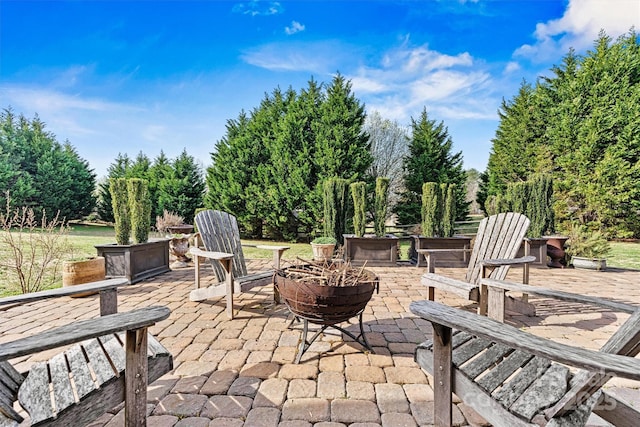 view of patio with a fire pit