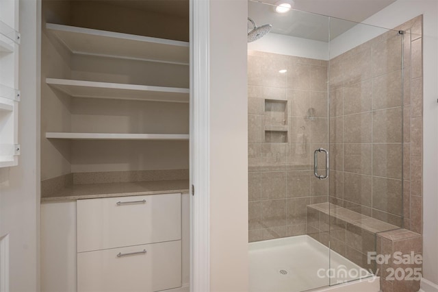 full bathroom with a shower stall