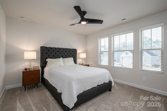 bedroom with carpet floors, visible vents, baseboards, and a ceiling fan