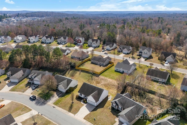 bird's eye view with a residential view and a wooded view