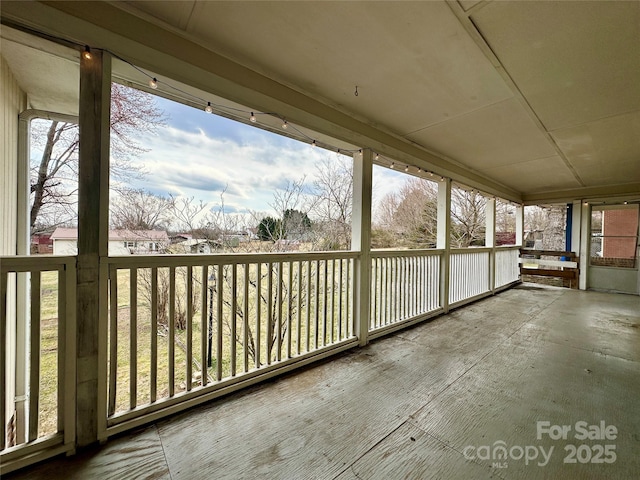 unfurnished sunroom featuring a healthy amount of sunlight