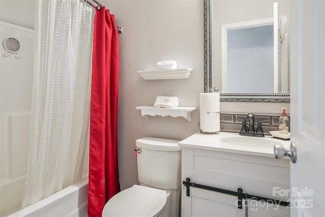 bathroom with shower / bath combination with curtain, vanity, and toilet