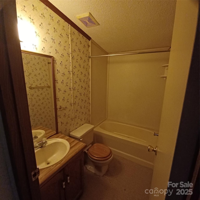 full bath featuring visible vents, toilet, a textured ceiling, vanity, and wallpapered walls